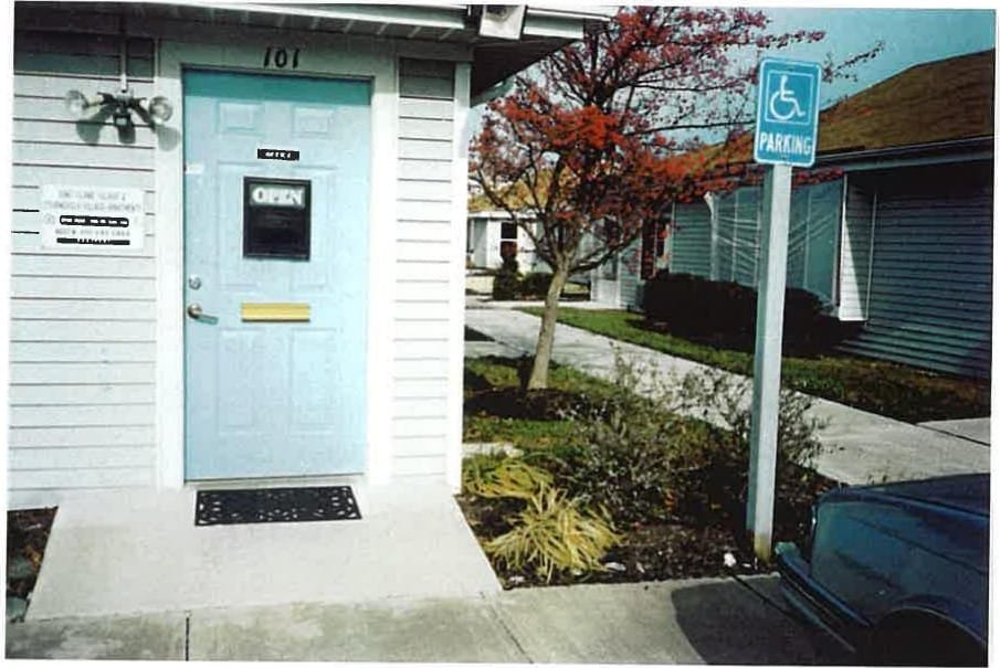 The on-site rental office entrance at Stevensville Village with an accessible parking space out front